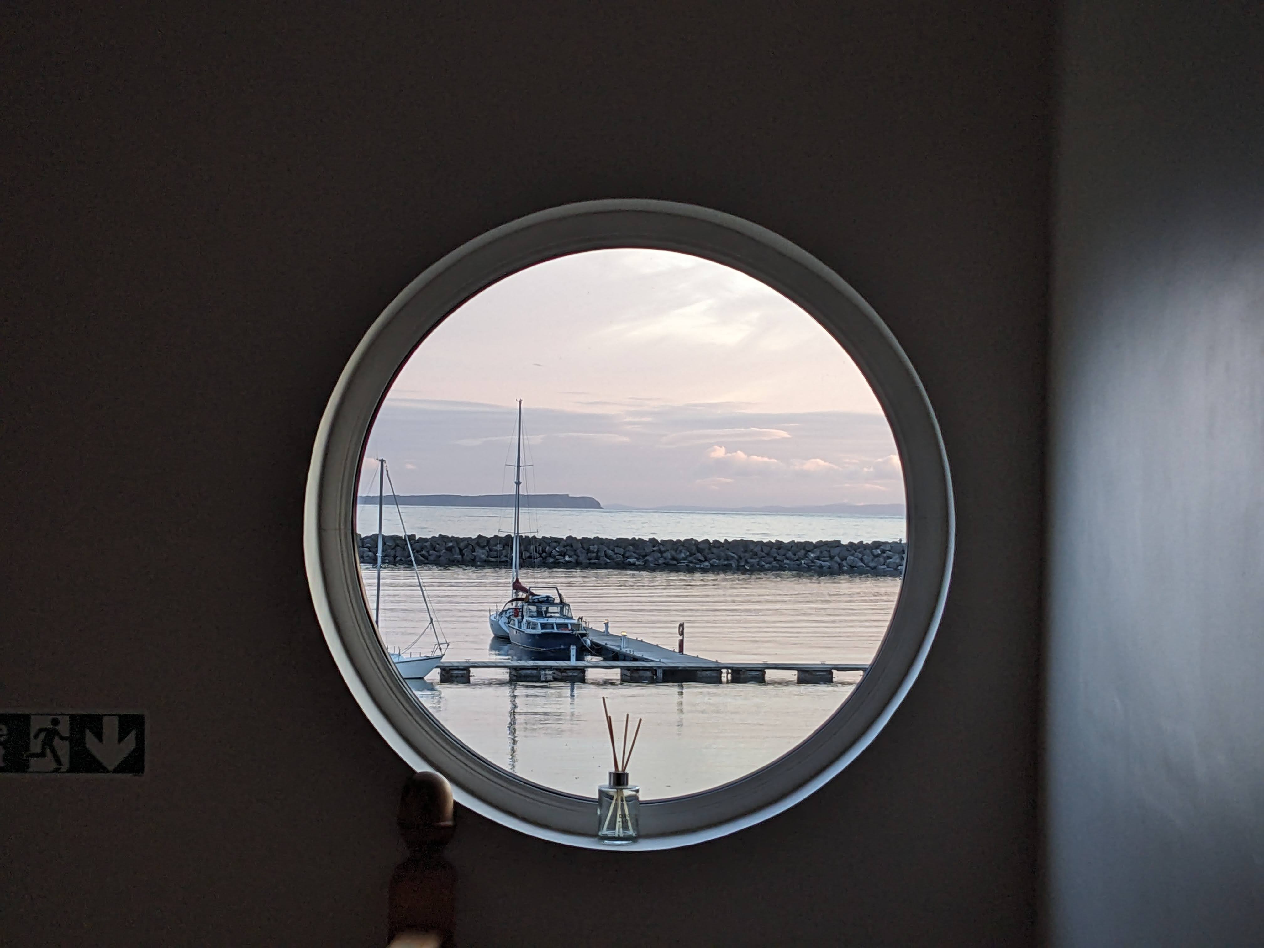 A view of the harbour through a circular window